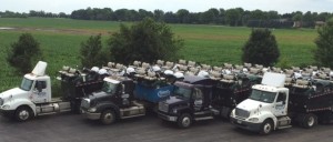 rental golf cars available from Harris Golf Cars on flatbed trucks